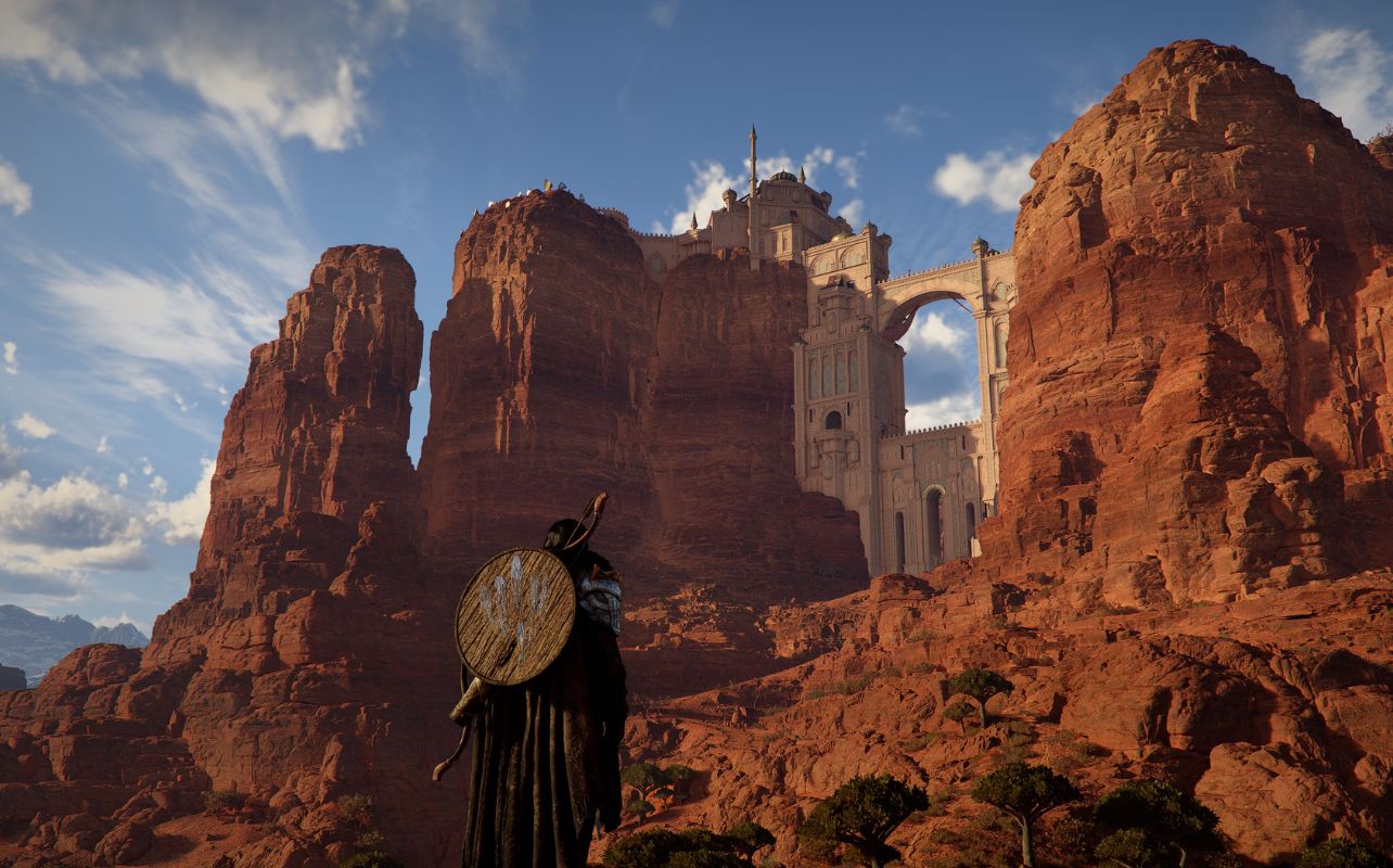 Crimson Desert video game screenshot with the main character Kliff looking a desert castle.