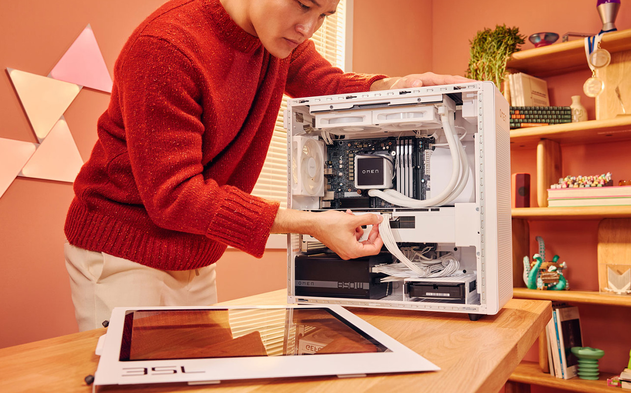 Person assembling a HP OMEN desktop PC