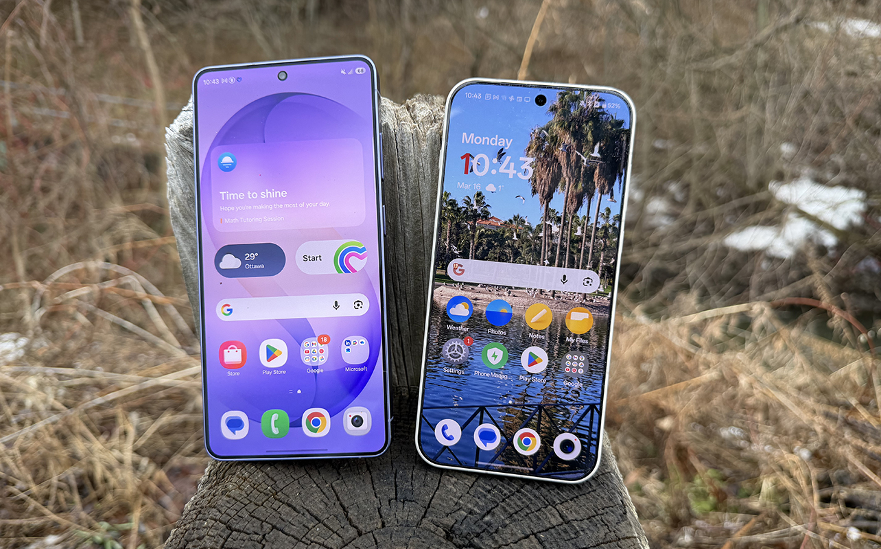 Samsung Galaxy S26 Ultra beside the OnePlus 15 outside by grass.