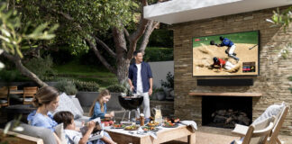 Samsung The Terrace TV with a family outside on a deck.