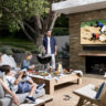 Samsung The Terrace TV with a family outside on a deck.