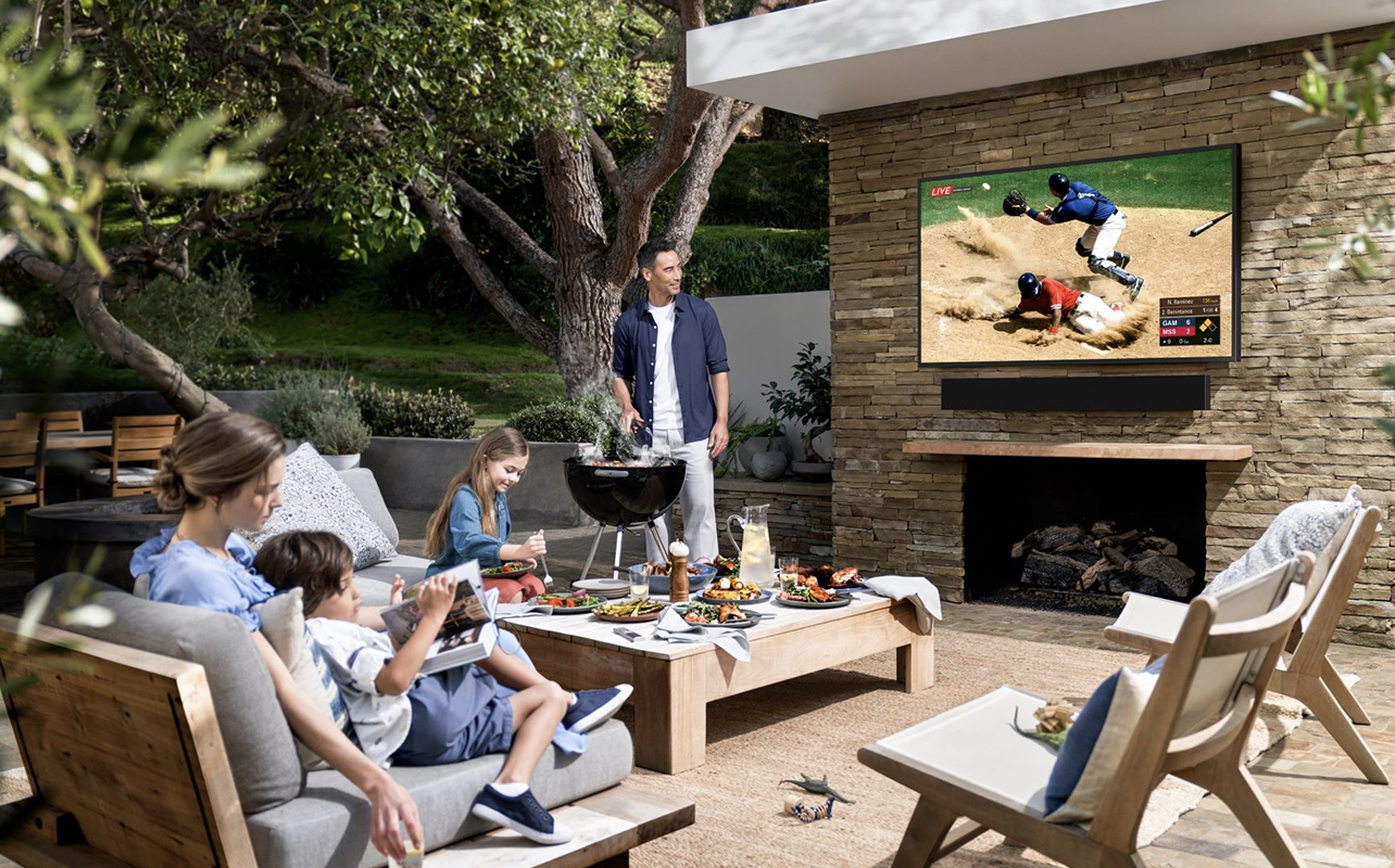 Samsung The Terrace TV with a family outside on a deck.