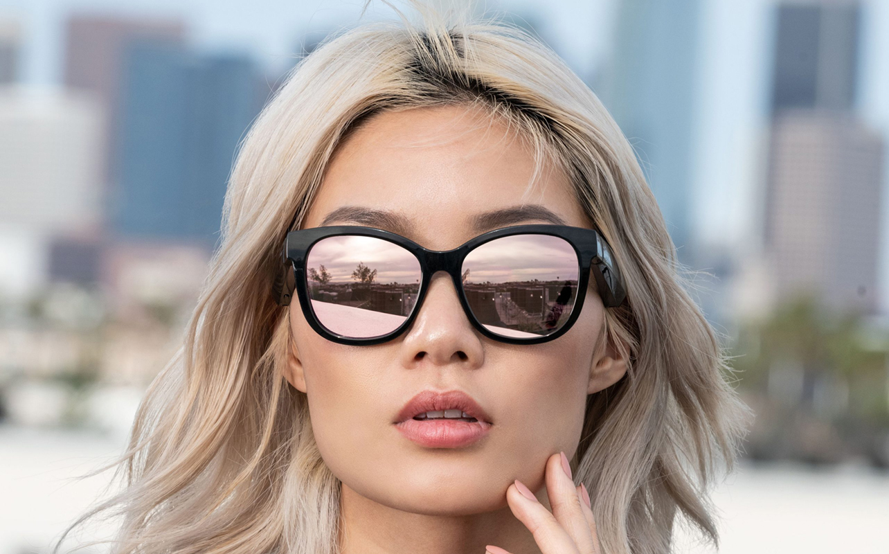 Woman wearing Bose Frames Soprano audio glasses.
