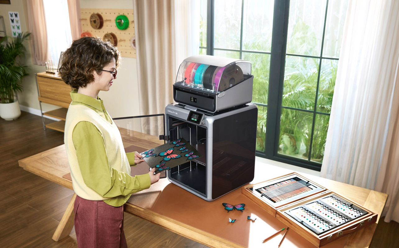 Woman using a 3D printer on a table at home.
