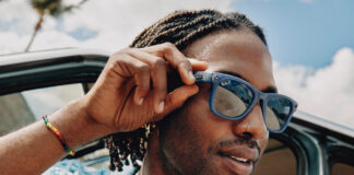 Man wearing Meta RayBan smart glasses in summer.