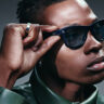 Stylish man wearing Ray-Ban Meta Gen 2 smart glasses.