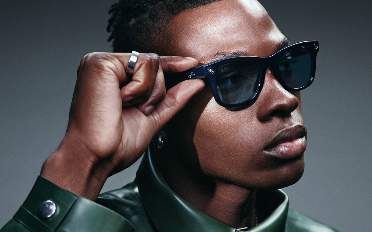 Stylish man wearing Ray-Ban Meta Gen 2 smart glasses.