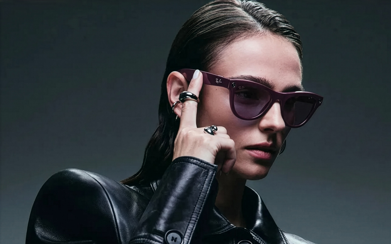Stylish woman wearing Ray-Ban Meta Gen 2 smart glasses.