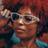 Woman wearing Ray-Ban Meta Skyler AI glasses.