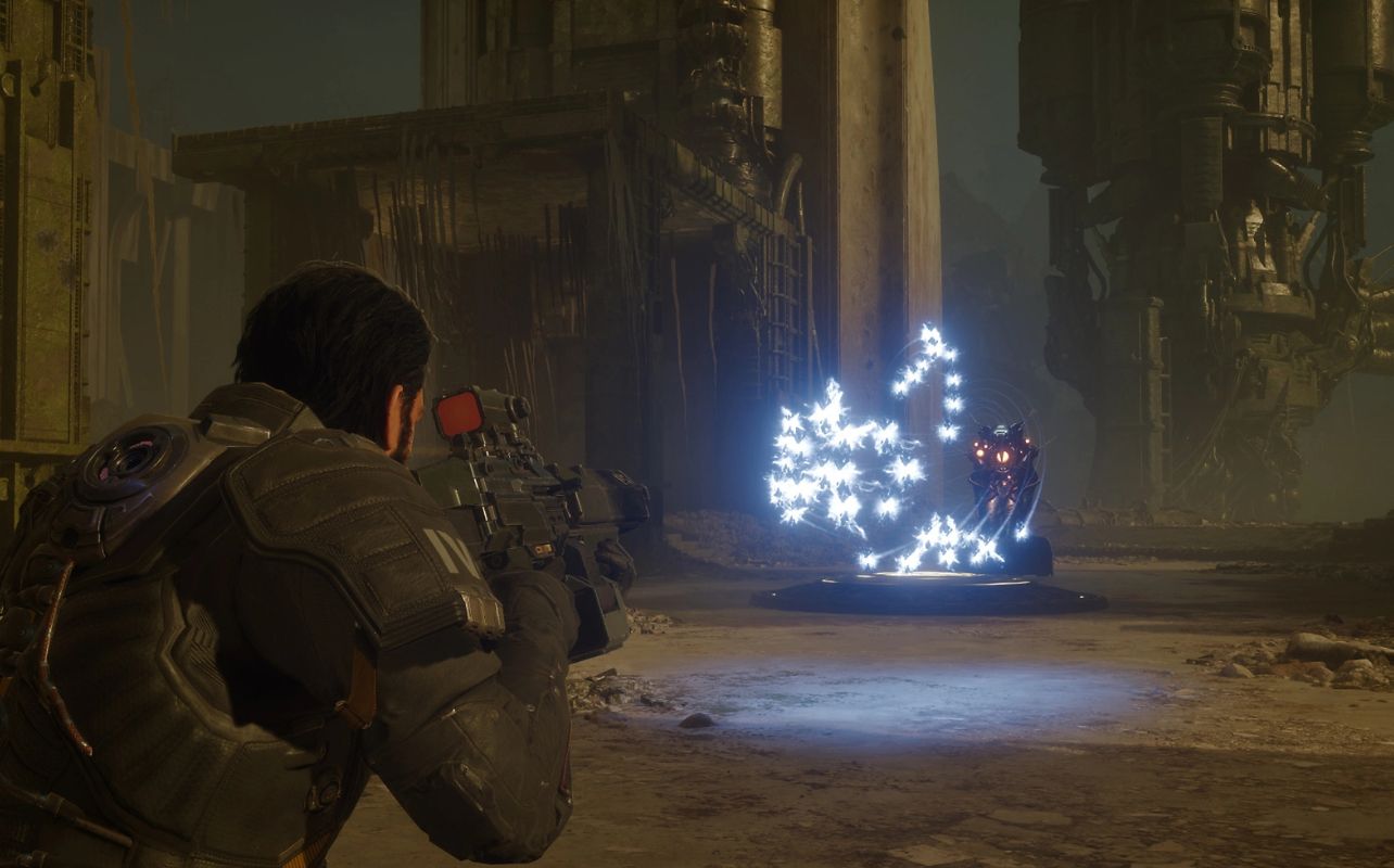 A futuristic soldier from the video game Saros shoots at an alien gun emplacement.