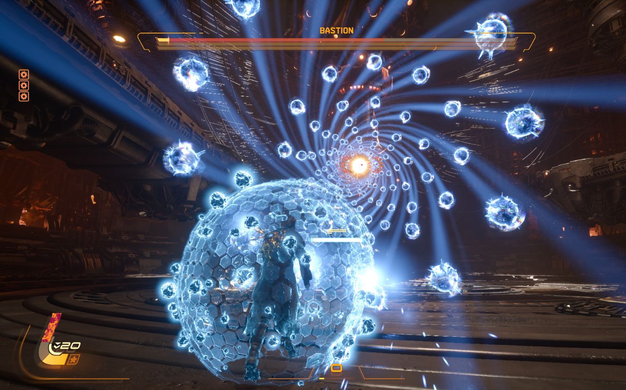 Capture de Saros montrant un personnage entouré d’un bouclier lumineux avec des projectiles fonçant vers lui.