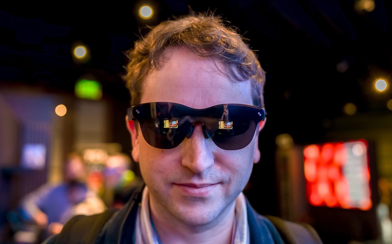 Man wearing RayNeo smart glasses at CES 2026.