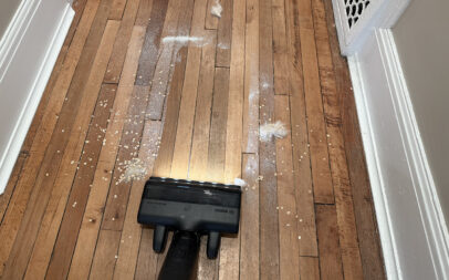 Bosch U10 cordless vacuum cleaning a mess on a floor