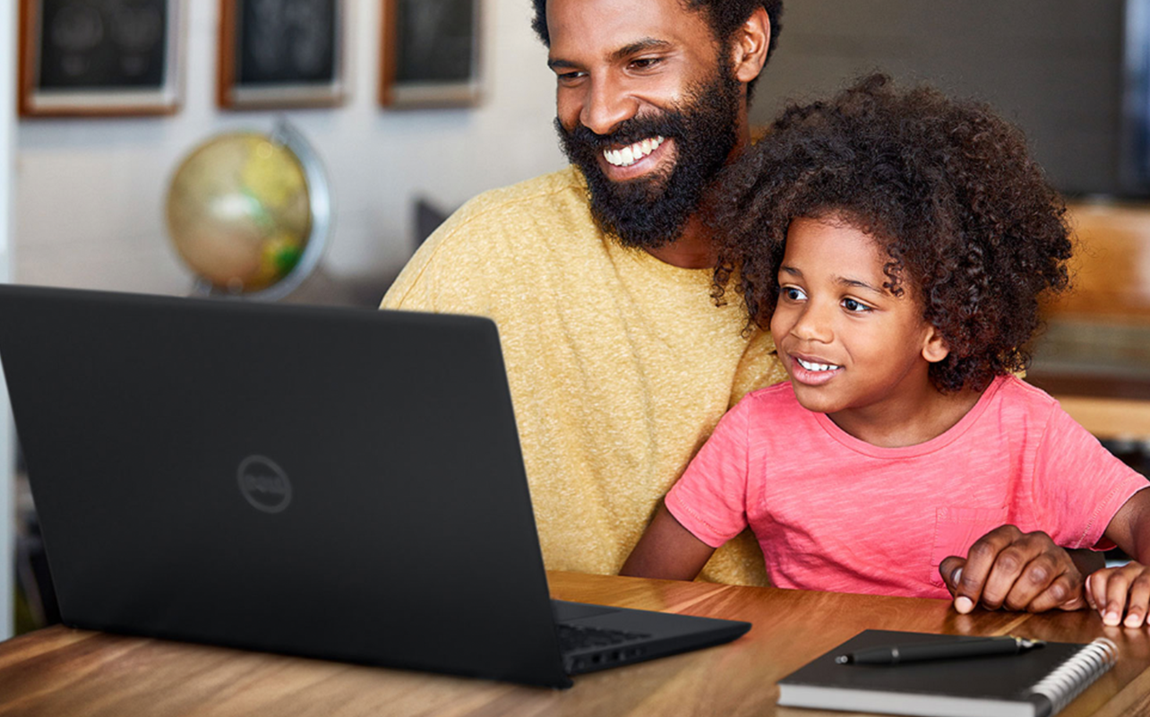 A father with his child using a Dell laptop.