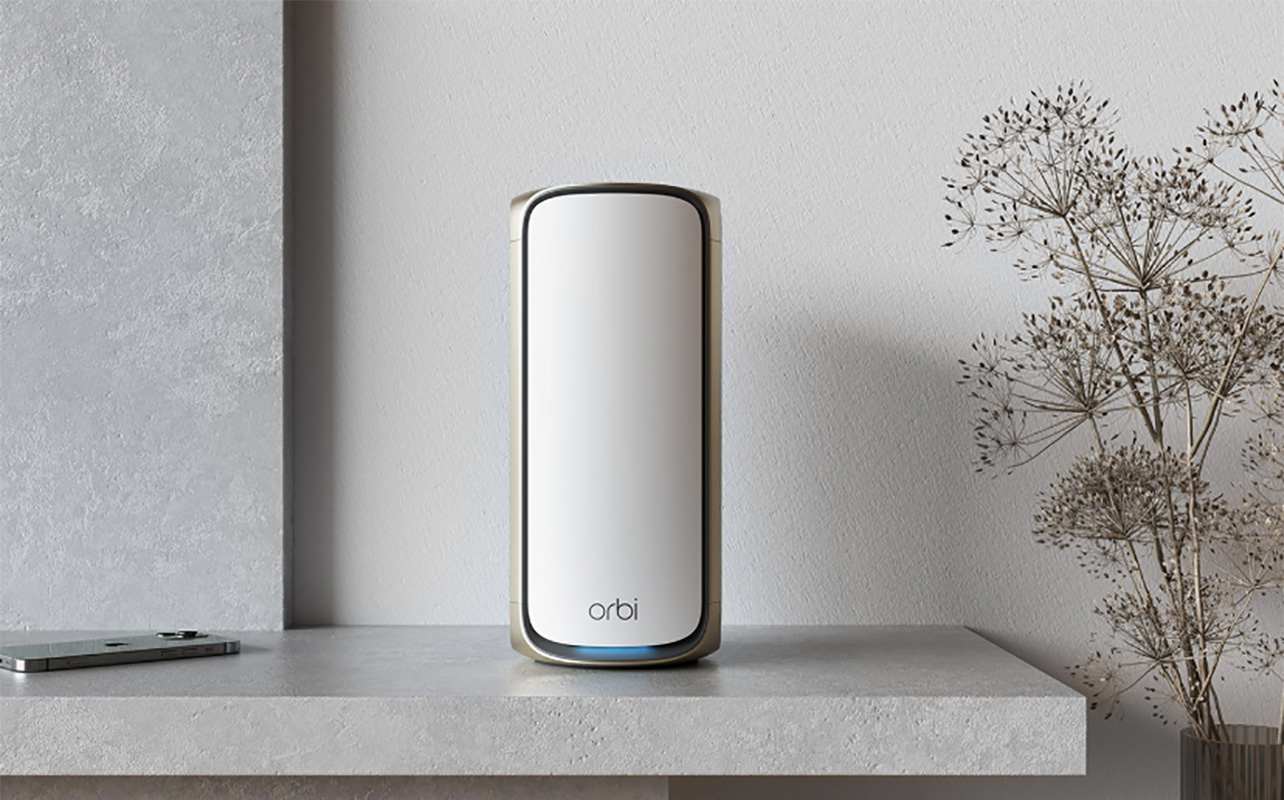 A Netgear Orbi mesh Wi-Fi node on a table.