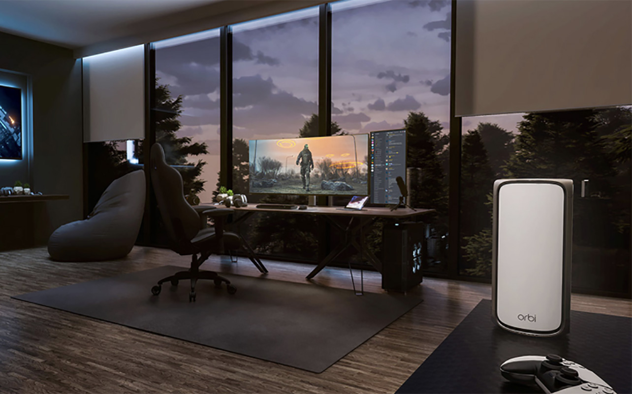 A Netgear Orbi mesh Wi-Fi node in the foreground of a living room.