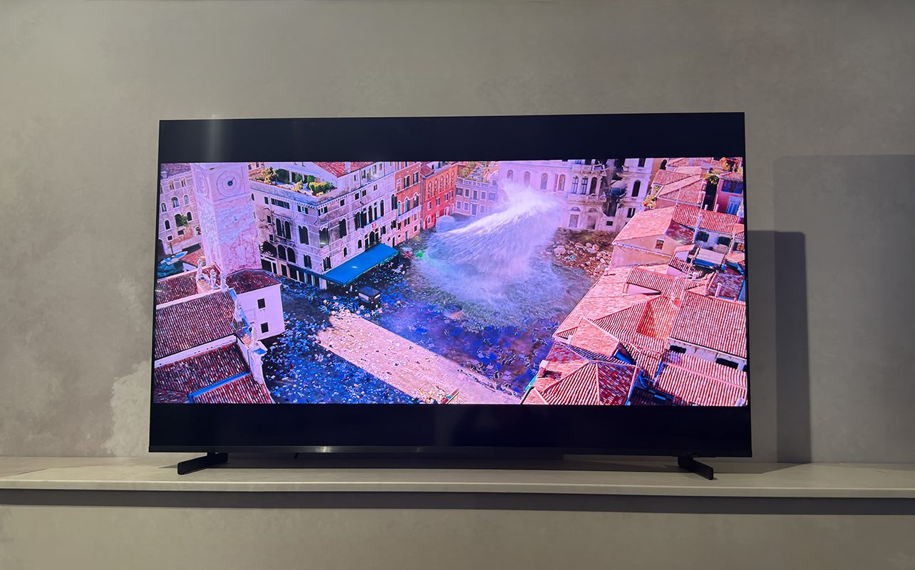 The Samsung R85H Micro RGB TV on a stand showing a scene from Spider-Man: Far From Home.