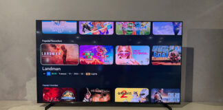 The Samsung R85H Micro RGB on a stand showing the menu.