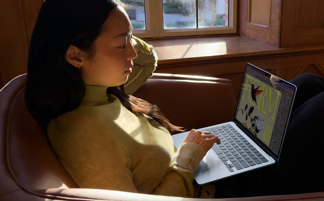 Woman designing on MacBook