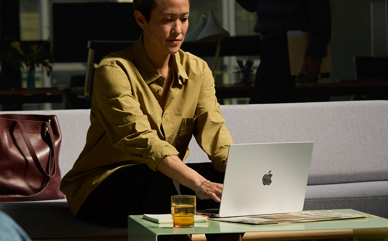 Person using a MacBook pro in the office
