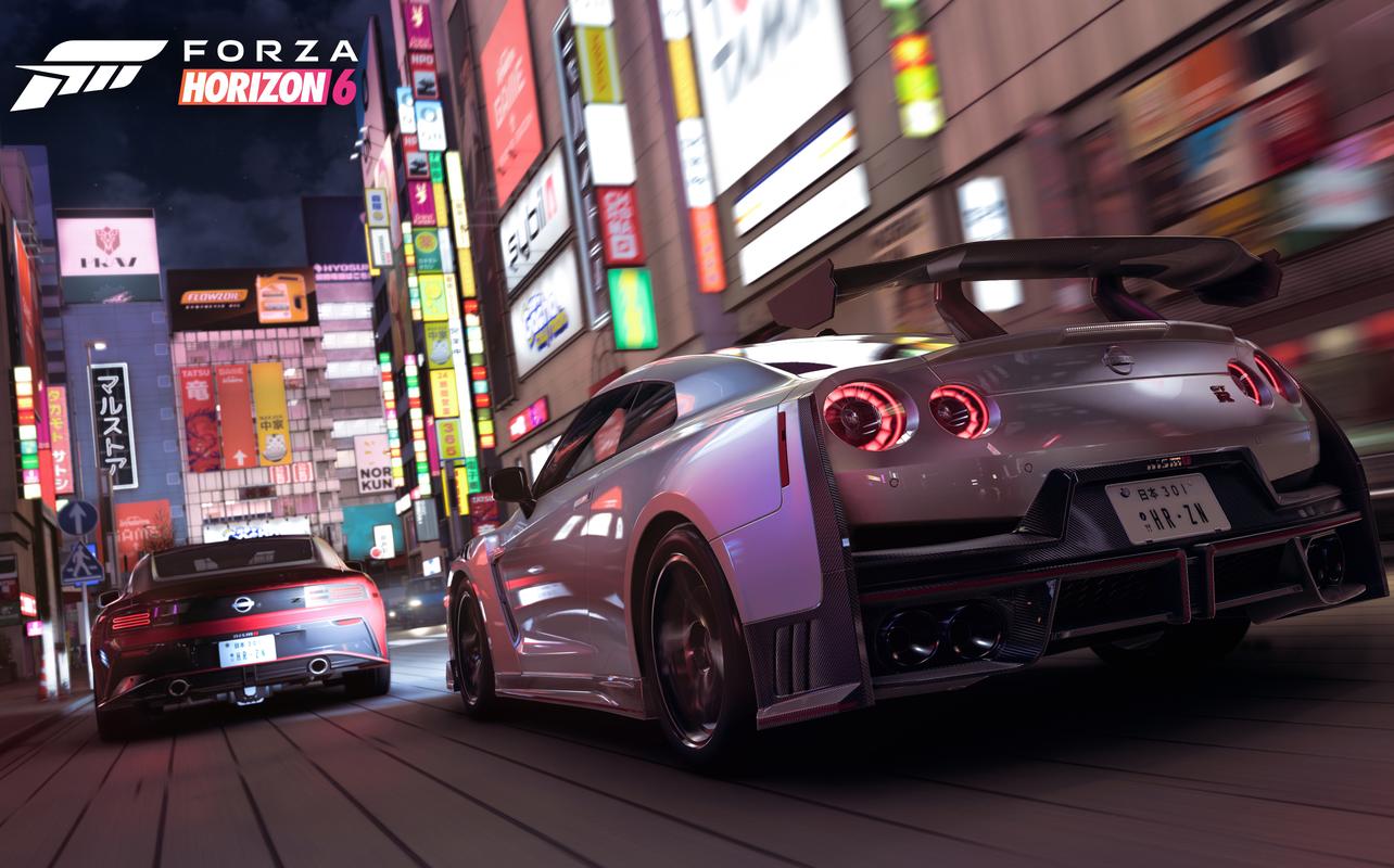 A white Nissan GT-R racing through the streets of Tokyo City at night in Forza Horizon 6.