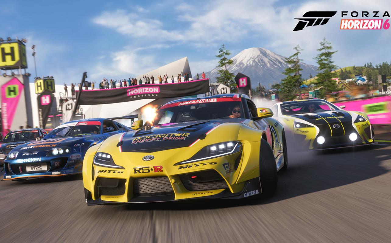 A yellow Toyota Supra drifts through a festival race track with Mount Fuji in the background of Forza Horizon 6.