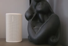 Sonos Play on a side table beside a sculpture.