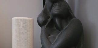 Sonos Play on a side table beside a sculpture.