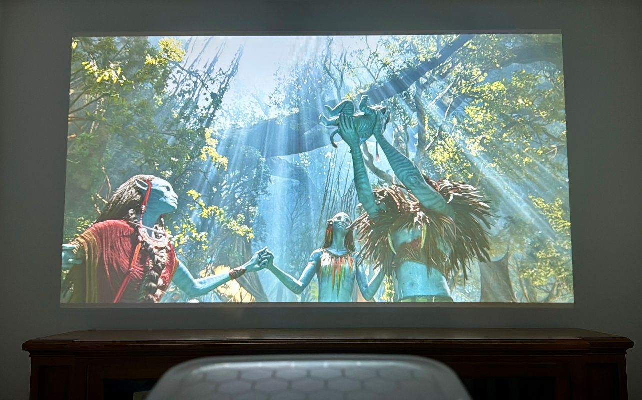 The Brother Eye Mark III Elite Smart LCD Projector is displaying the movie Avatar.