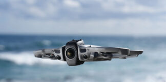 DJI Avata 360 in flight by the beach.