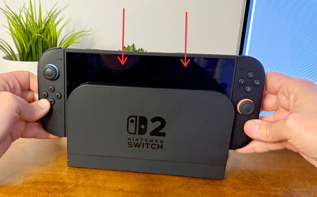 The Nintendo Switch 2 is being put into the dock correctly by Matthew Rondina.