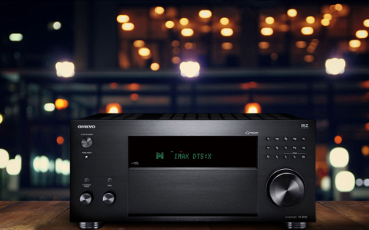 The Onkyo TXRZ50 receiver is showcased with bright lights in the background.