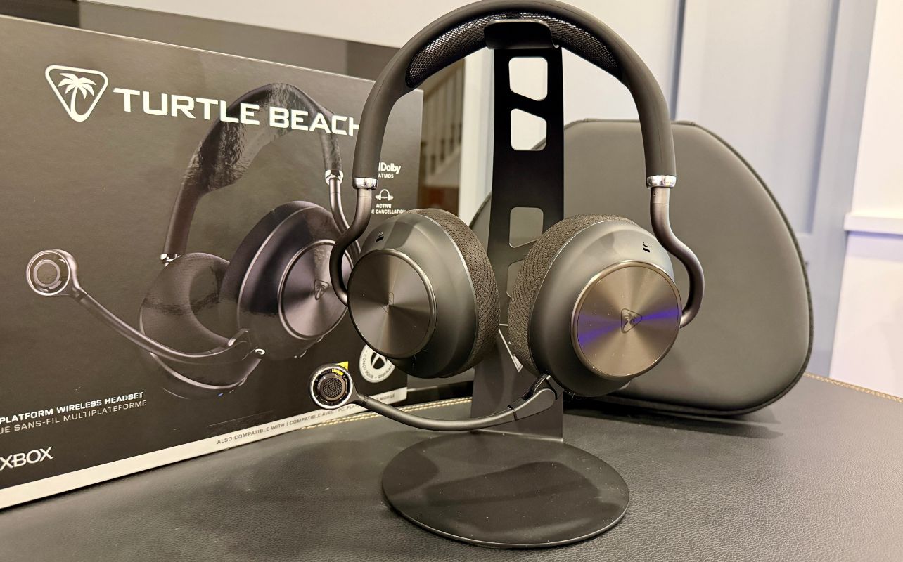 Turtle Beach Stealth Pro II on a black desk tabletop on a stand, with a box and case in the background.