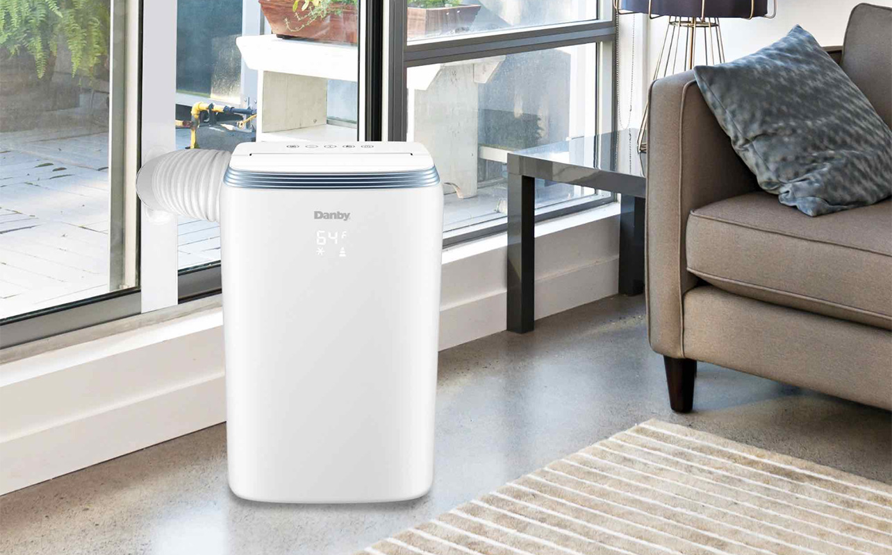A Danby portable air conditioner in a living room.