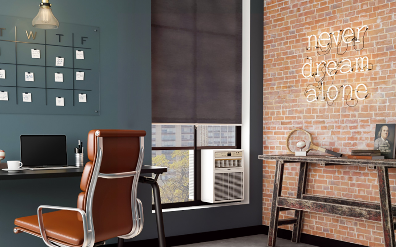 A Danby window air conditioner mounted in a home office.
