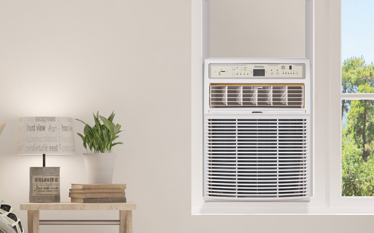 A Danby window air conditioner on the wall.
