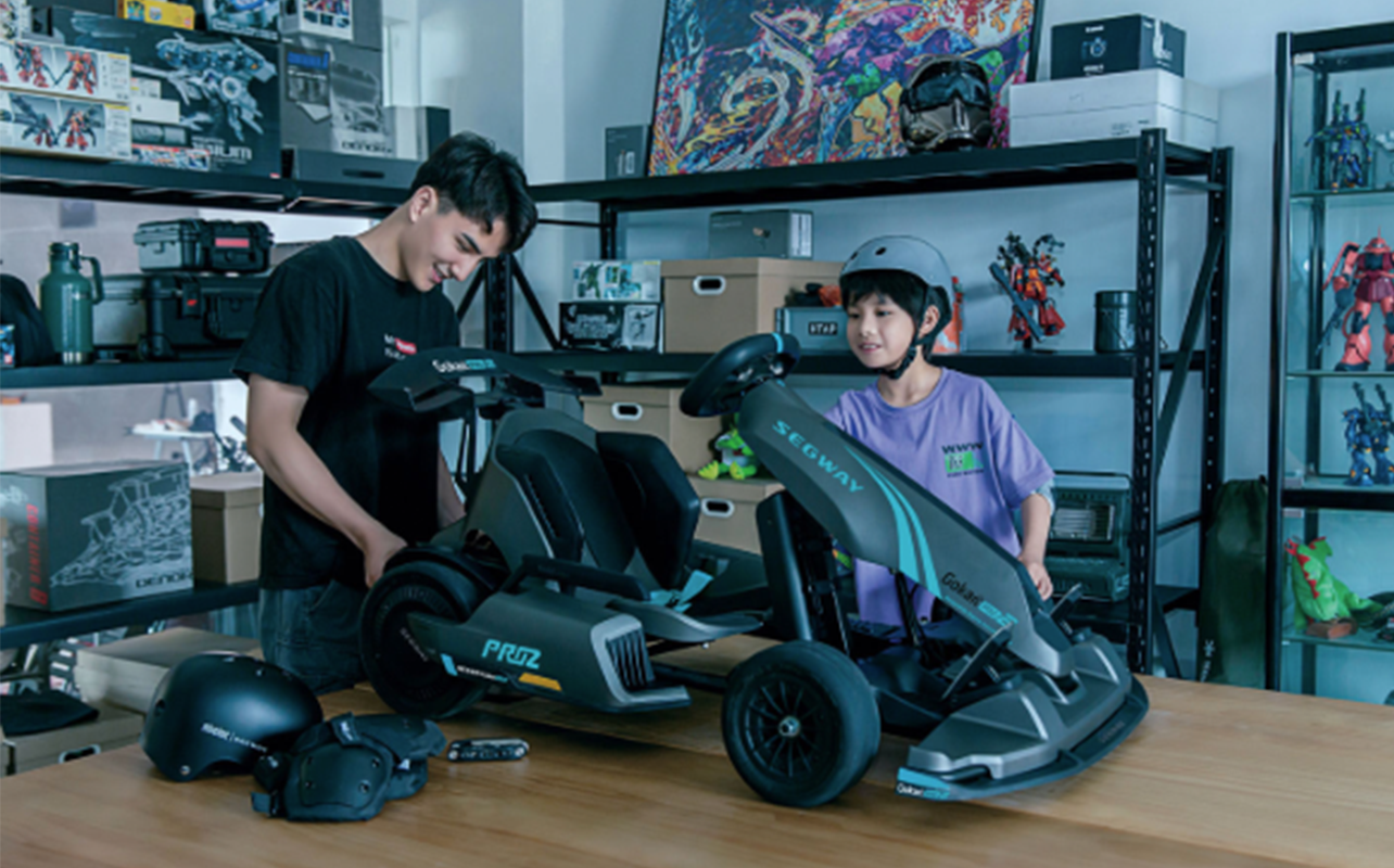 A couple of young persons play around with their Segway Gokart Pro2 Electric Go Kart