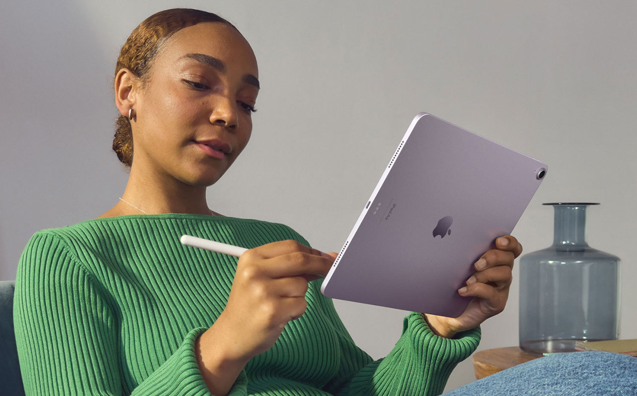 Woman taking notes on iPad