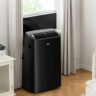 Midea Duo portable air conditioner venting out a window.
