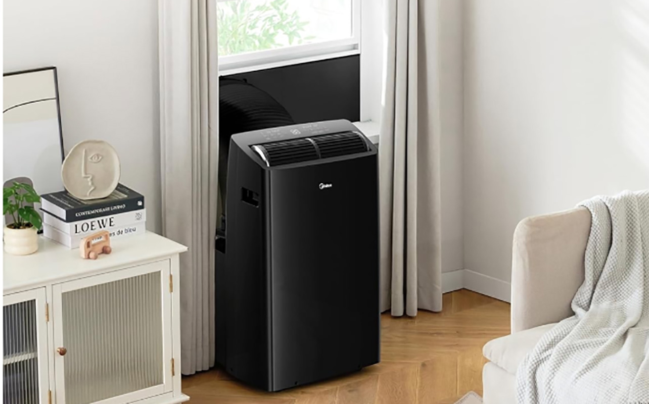 Midea Duo portable air conditioner venting out a window.
