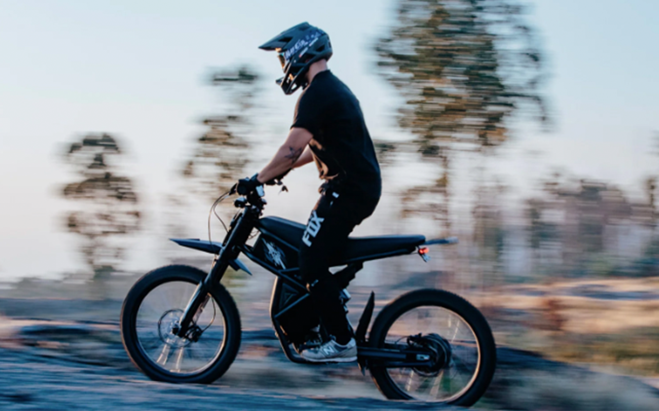a person rides a motorcycle-style e-bike