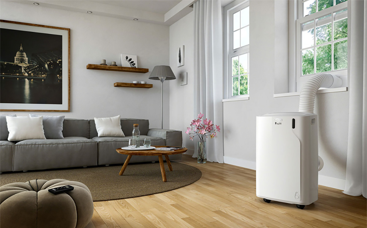 A portable AC unit in a living room.