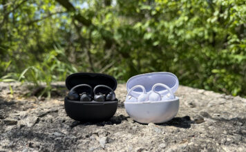 Shokz OpenDots 2 and OpenDots Air in their cases outside on a rock.