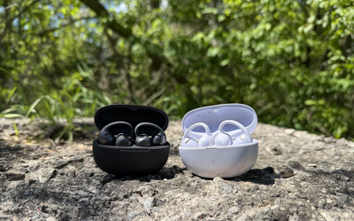 Shokz OpenDots 2 and OpenDots Air in their cases outside on a rock.
