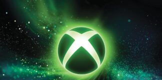 Glowing XBOX logo surrounded by green and blue particle effects on a dark background.