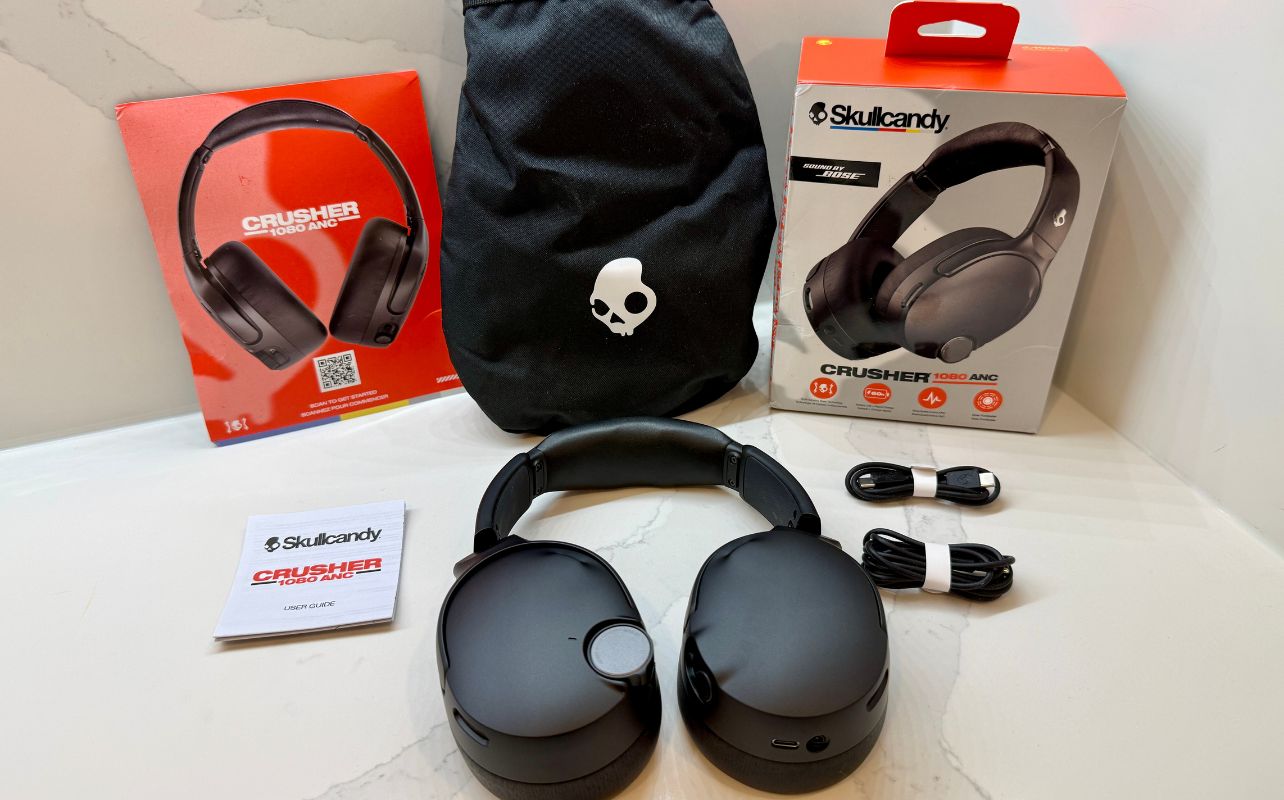 The contents of the Skullcandy Crusher 1080 ANC package opened and displayed.