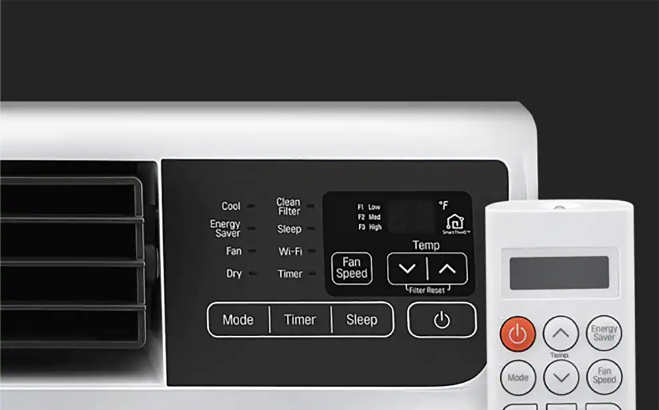 Close-up of an LG window air conditioner and its remote.