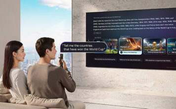 A couple using voice commands on a Samsung AI TV