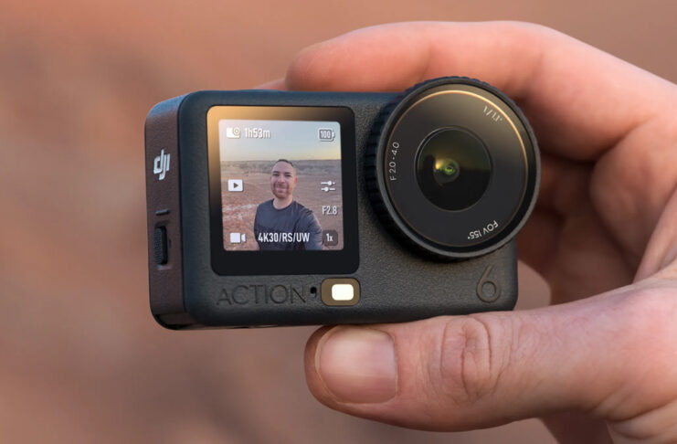 The DJI Osmo Action 6 captures adventure and plenty more Man holding DJI Osmo Action 6 at himself outdoors.