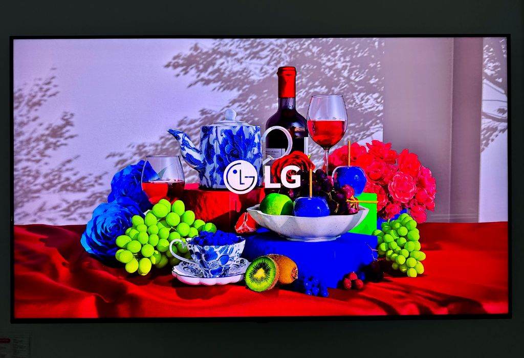 LG RGB evo Review Banner TV with fruit and wine glasses displayed with stunning colours.